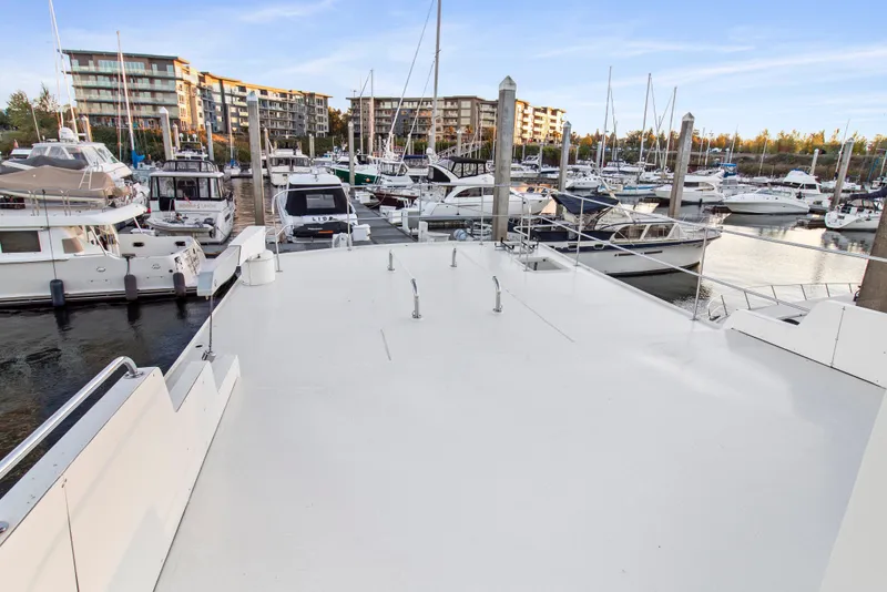 Slide: The Image of Marina view from 2006 Solander Eclipse Steel Trawler, showcasing docked boats and waterfront buildings. - 66