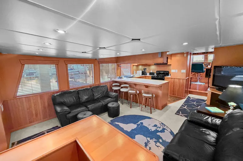 Slide: The Image of Luxurious interior of 2006 Solander Eclipse Steel Trawler with modern kitchen and cozy seating area. - 15