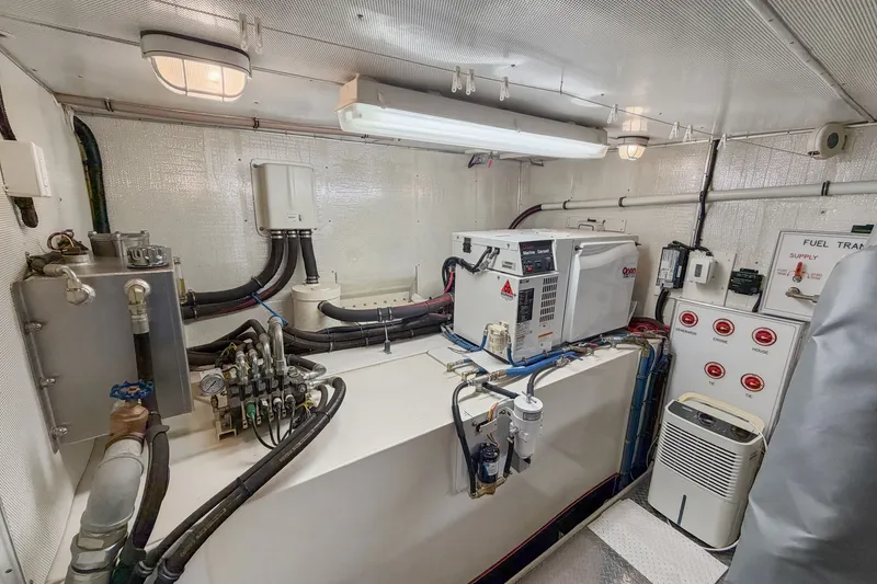 Slide: The Image of Engine room of 2006 Solander Eclipse Steel Trawler with equipment and control panels. - 48