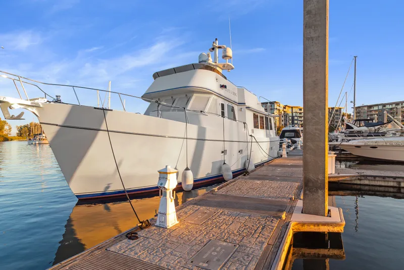 The Image of 2006 Solander Eclipse Steel Trawler docked at marina, under clear blue sky. - 0
