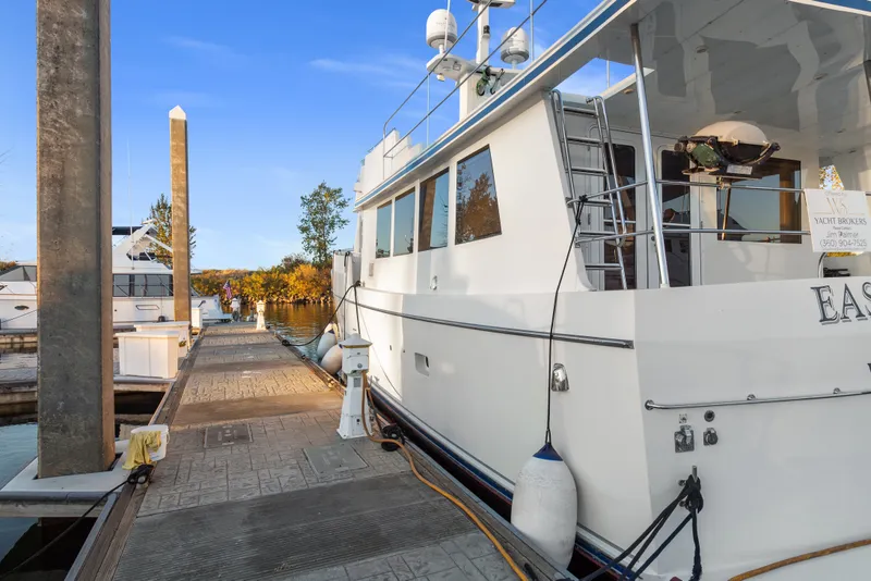 Slide: The Image of Docked 2006 Solander Eclipse Steel Trawler yacht under clear blue sky. - 2