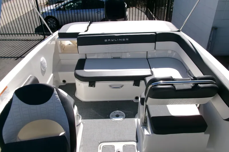 Slide: The Image of 2022 Bayliner VR6 Bowrider OB interior with cushioned seating and modern design. - 13