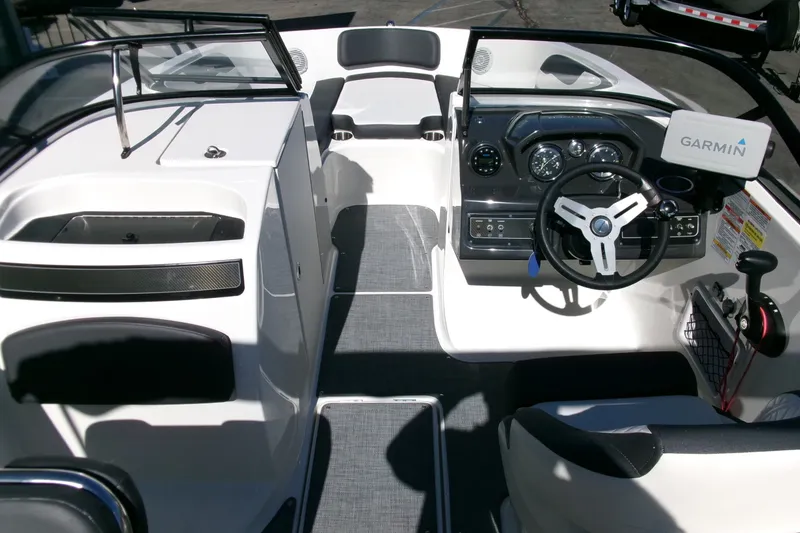 Slide: The Image of 2022 Bayliner VR6 Bowrider OB interior with Garmin navigation system and modern dashboard. - 6