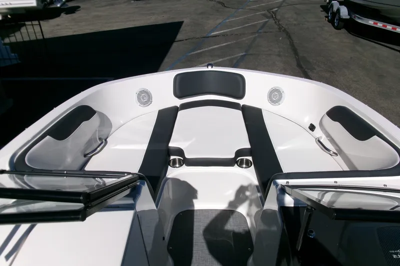 Slide: The Image of 2022 Bayliner VR6 Bowrider OB interior with spacious seating and cup holders. - 4