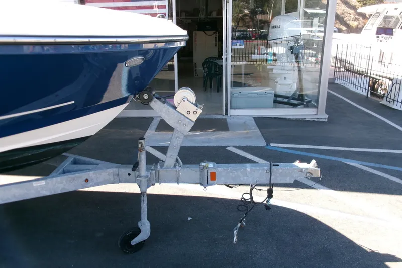 Slide: The Image of 2022 Bayliner VR6 Bowrider OB on trailer outside a showroom. - 23
