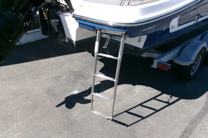 Slide: The Image of 2022 Bayliner VR6 Bowrider OB with ladder on trailer, rear view. - 22