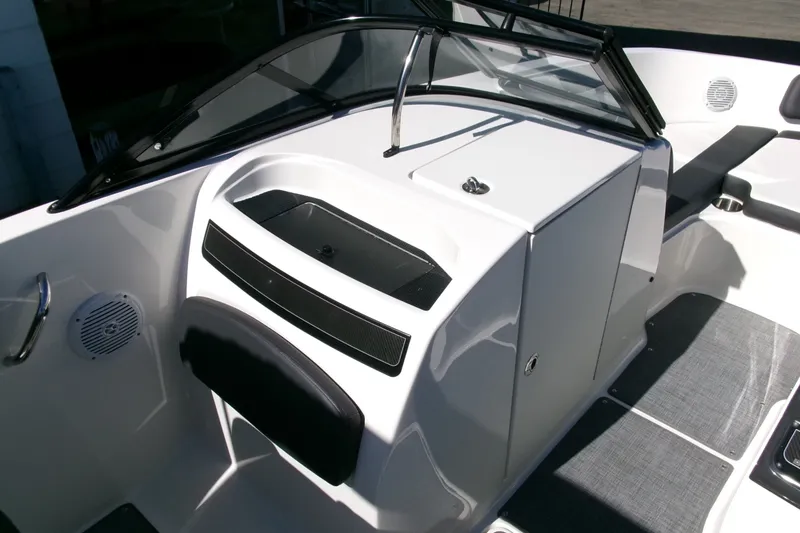 Slide: The Image of 2022 Bayliner VR6 Bowrider OB interior with sleek dashboard and seating area. - 9