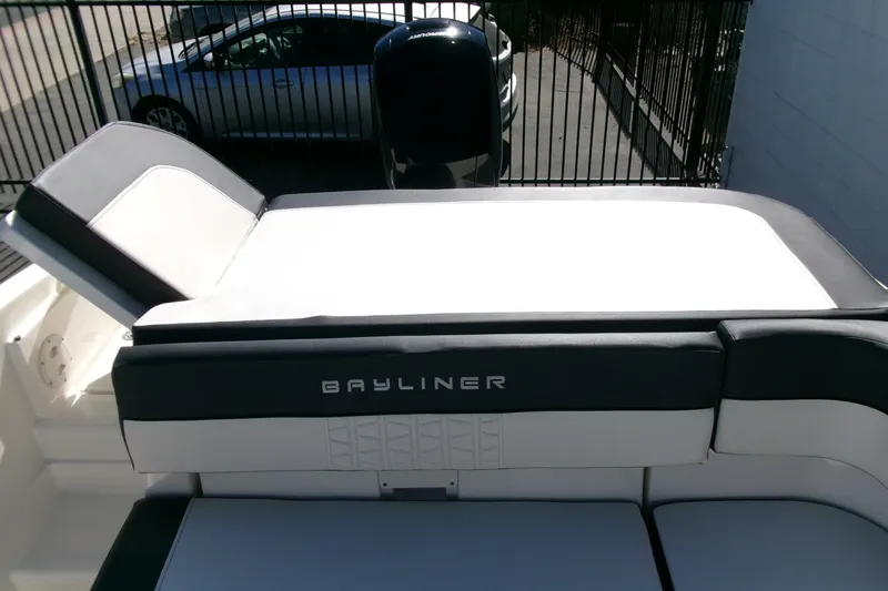 Slide: The Image of 2022 Bayliner VR6 Bowrider OB boat interior with cushioned seating and sleek design. - 18