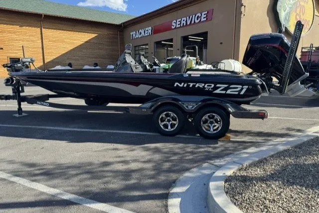 Slide: The Image of 2024 Nitro Z21 XL Pro boat parked outside Tracker service center. - 1