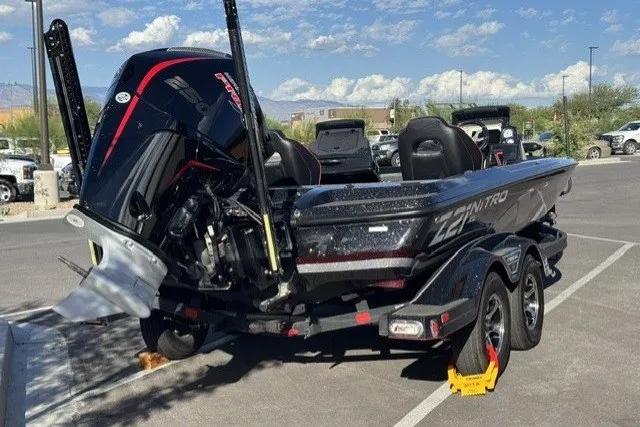 Slide: The Image of 2024 Nitro Z21 XL Pro boat on trailer in parking lot, sunny day. - 3
