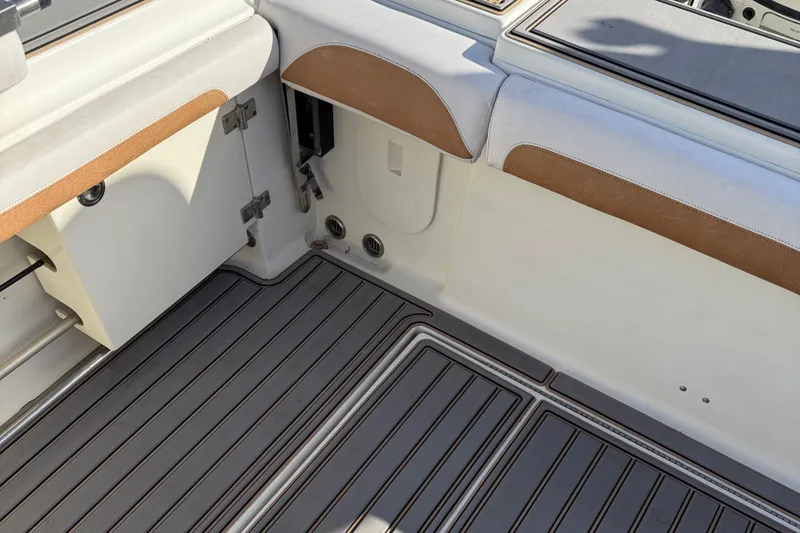 Slide: The Image of 2005 Hydra-Sports Vector 3300 VX boat interior with cushioned seating and non-slip flooring. - 4