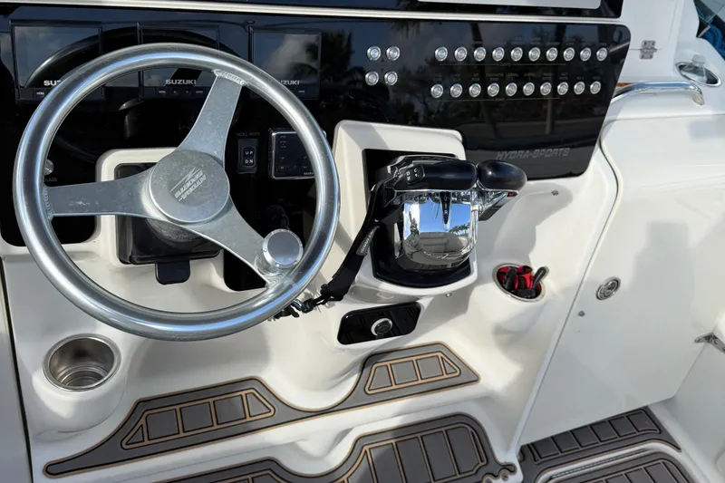 Slide: The Image of 2005 Hydra-Sports Vector 3300 VX helm with steering wheel and controls. - 12