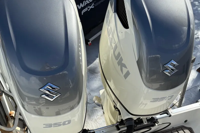 Slide: The Image of Twin Suzuki 350 outboard engines on a 2005 Hydra-Sports Vector 3300 VX boat. - 3