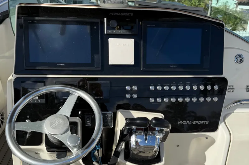 Slide: The Image of Control panel of a 2005 Hydra-Sports Vector 3300 VX boat with dual Garmin displays. - 11
