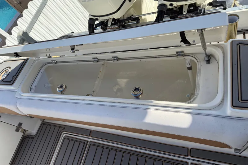 Slide: The Image of 2005 Hydra-Sports Vector 3300 VX boat with open storage compartment on deck. - 6