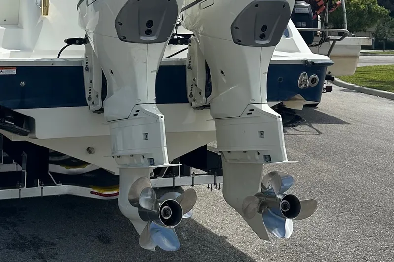 Slide: The Image of 2005 Hydra-Sports Vector 3300 VX boat with dual outboard motors on a trailer. - 2