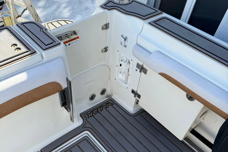 Slide: The Image of 2005 Hydra-Sports Vector 3300 VX boat interior with storage compartments and cushioned seating. - 8