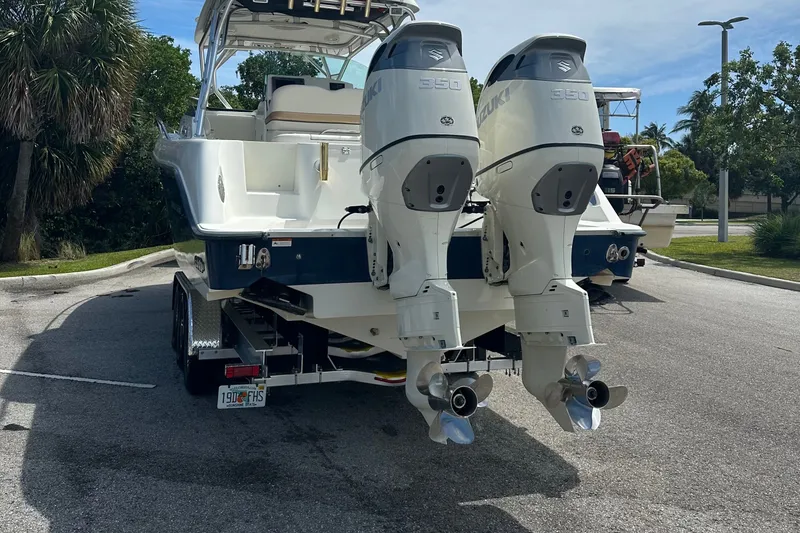 Slide: The Image of 2005 Hydra-Sports Vector 3300 VX boat with dual Suzuki 350 engines on a trailer. - 1