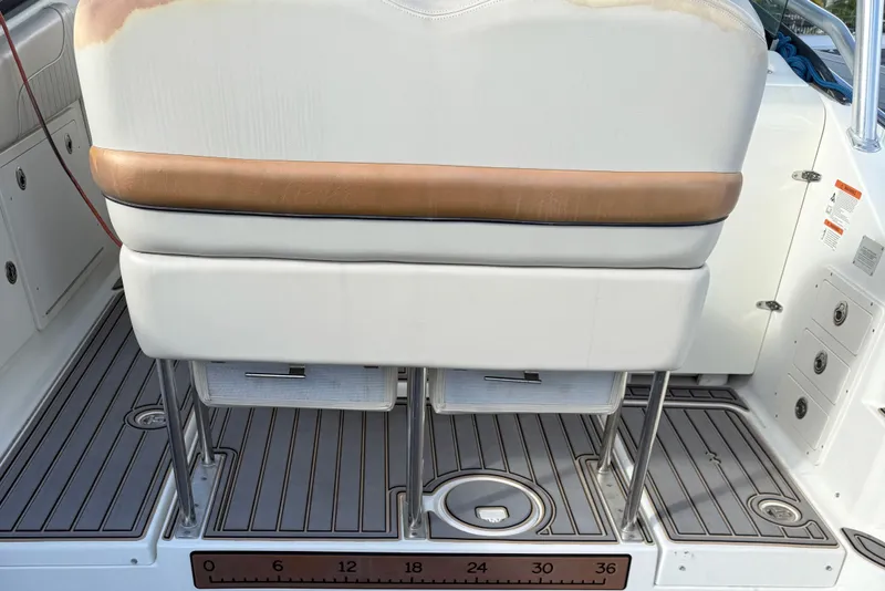 Slide: The Image of 2005 Hydra-Sports Vector 3300 VX boat interior with cushioned seating and deck details. - 9