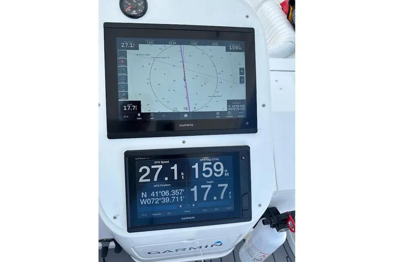 Slide: The Image of Garmin navigation screens on a 2001 Intrepid 348 Walkaround boat dashboard. - 10