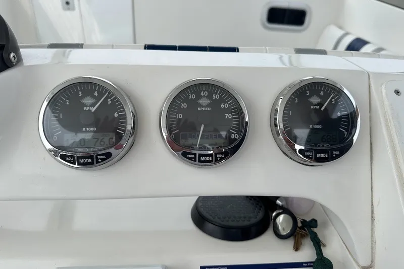 Slide: The Image of Dashboard of a 2001 Intrepid 348 Walkaround boat with RPM and speed gauges. - 9