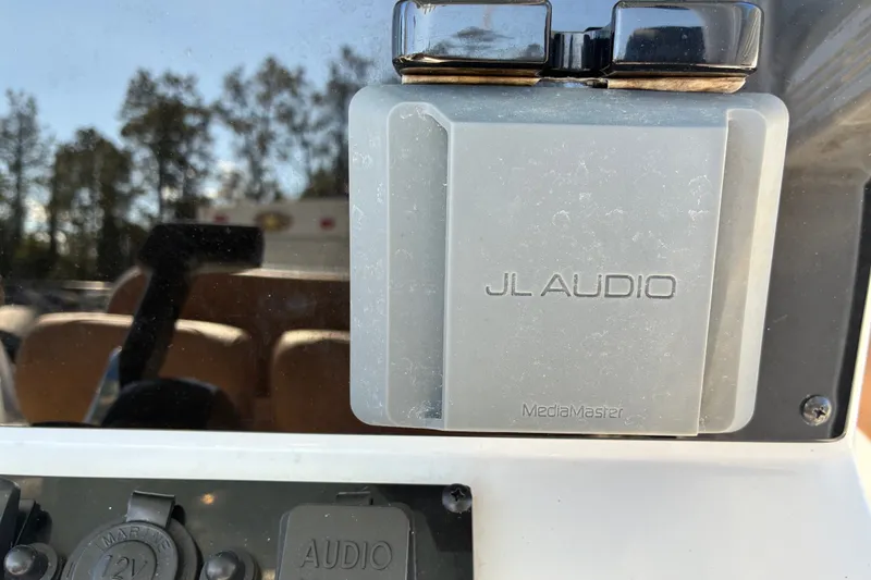 Slide: The Image of JL Audio MediaMaster on 2023 Sea Hunt Ultra 229 boat dashboard. - 11
