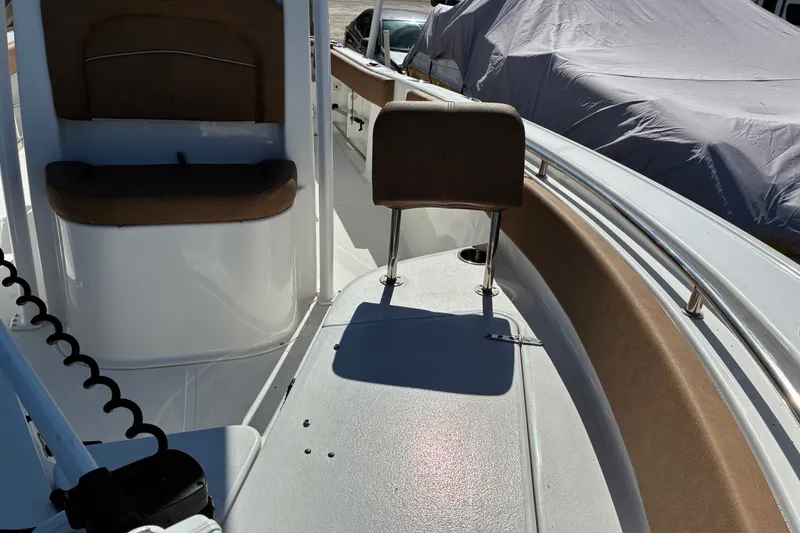 Slide: The Image of 2023 Sea Hunt Ultra 229 boat interior with seating and railings. - 31