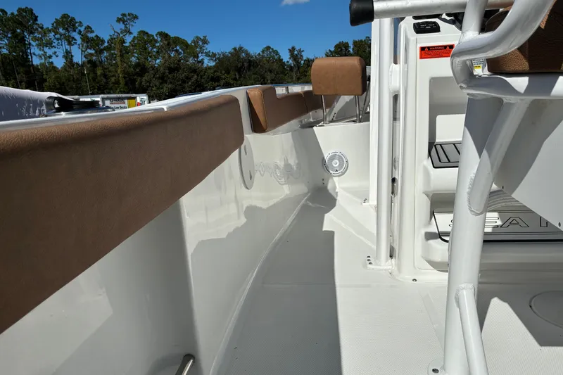 Slide: The Image of 2023 Sea Hunt Ultra 229 boat interior with cushioned seating and sleek design. - 48