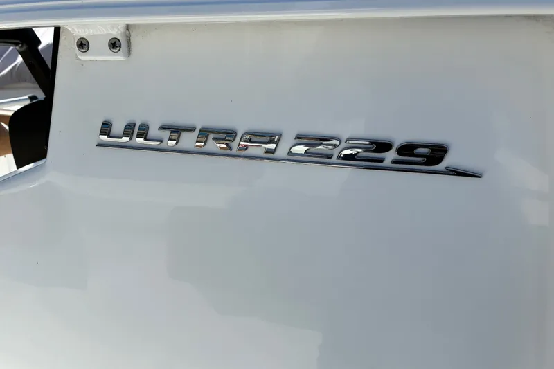 Slide: The Image of 2023 Sea Hunt Ultra 229 boat emblem on white surface. - 67