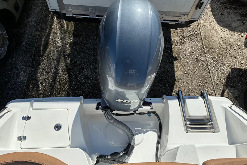 Slide: The Image of 2023 Sea Hunt Ultra 229 boat with Yamaha 200 engine and swim ladder. - 20