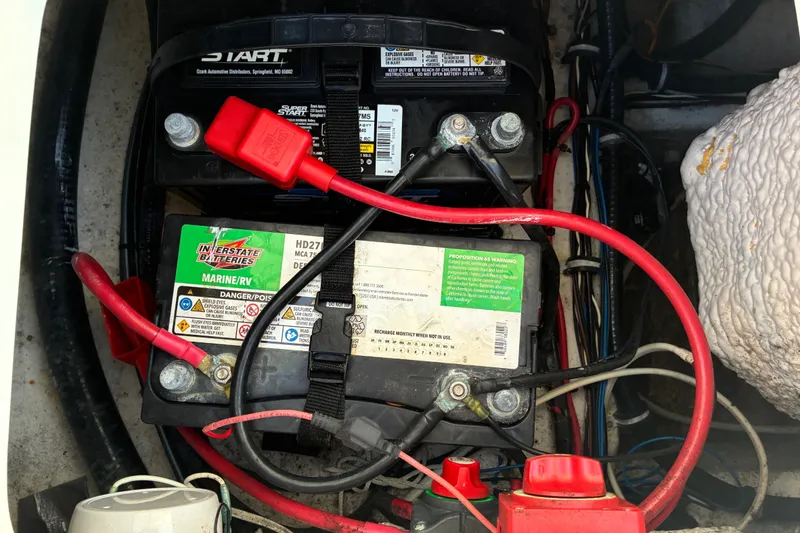 Slide: The Image of Marine battery setup in a 2023 Sea Hunt Ultra 229 boat. - 69