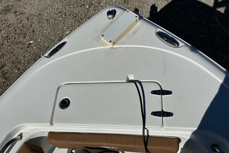 Slide: The Image of Bow of 2023 Sea Hunt Ultra 229 boat with storage compartment and cleats. - 35