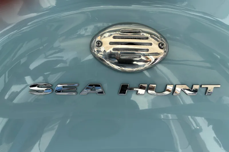 Slide: The Image of Chrome "Sea Hunt" logo on 2023 Ultra 229 boat. - 25