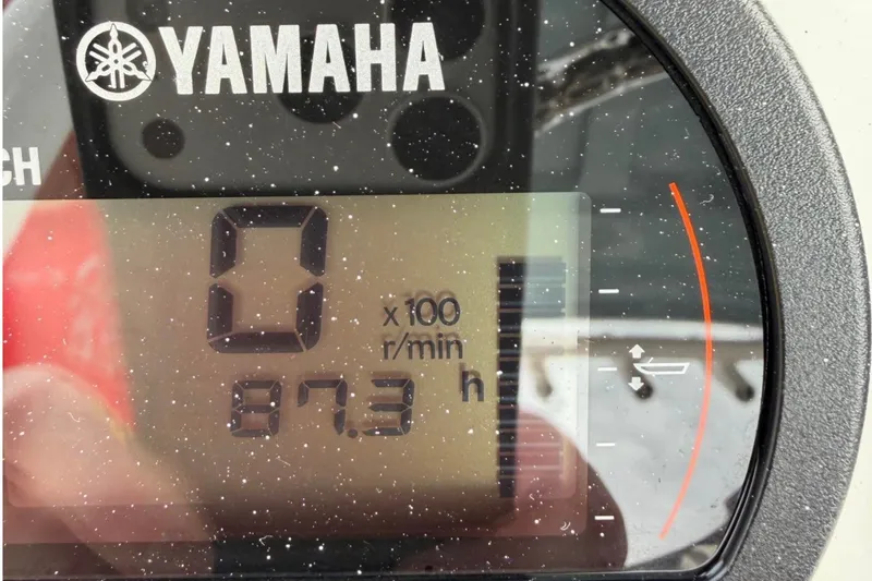 Slide: The Image of Yamaha engine display showing 87.3 hours on a 2023 Sea Hunt Ultra 229 boat. - 6