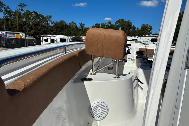 Slide: The Image of 2023 Sea Hunt Ultra 229 boat interior with brown seating and stainless steel railings. - 37