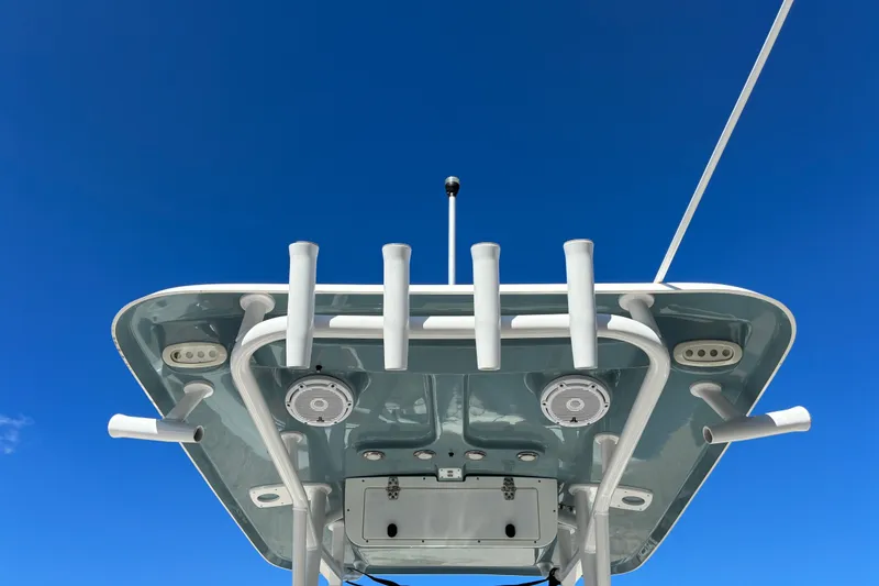 Slide: The Image of 2023 Sea Hunt Ultra 229 boat top view against clear blue sky. - 58