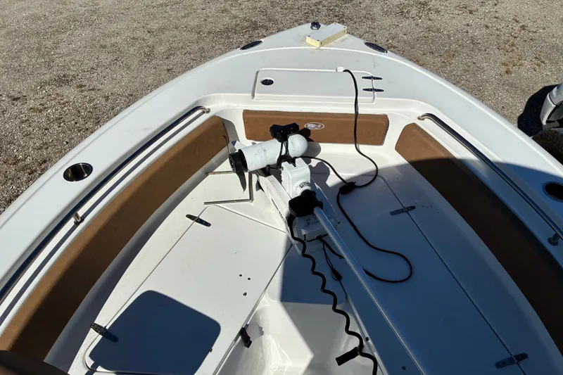 Slide: The Image of 2023 Sea Hunt Ultra 229 boat deck with trolling motor and seating. - 27