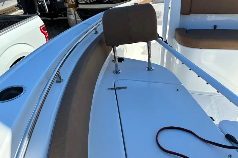 Slide: The Image of 2023 Sea Hunt Ultra 229 boat interior with seating and railing details. - 32