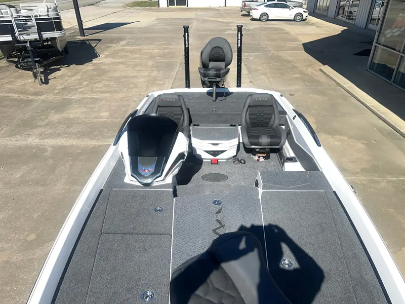 Slide: The Image of The image shows a 2027 Vexus VXs21 boat with a gray deck and black seats. - 18
