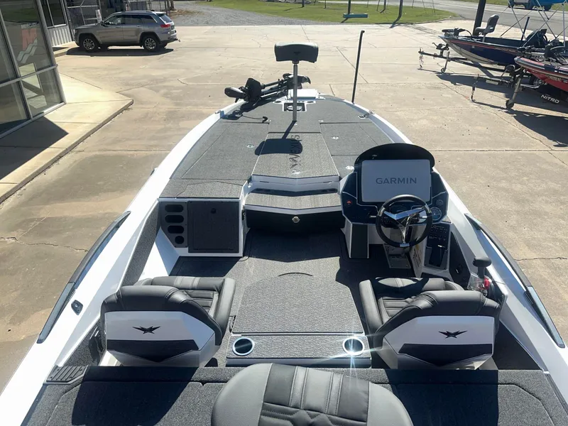 Slide: The Image of The image shows a 2027 Vexus VXs21 boat with a modern helm and two seats. - 14