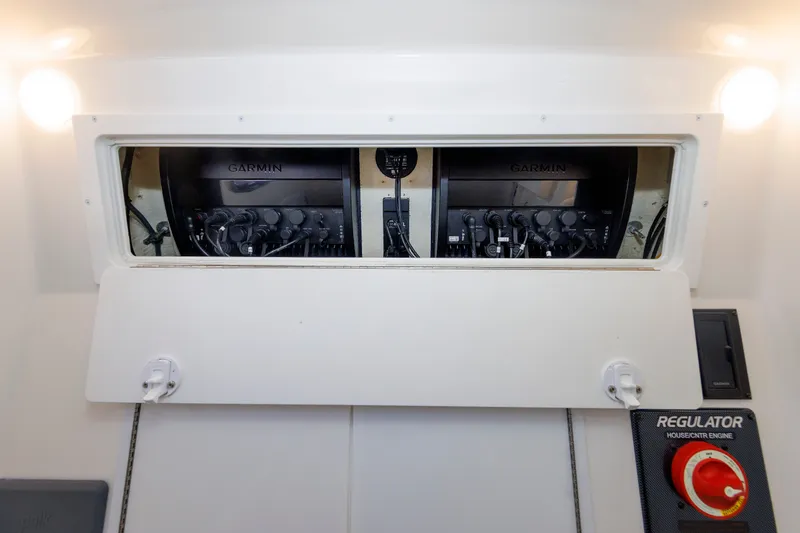Slide: The Image of The image shows a control panel with two Garmin devices and a Regulator switch. - 45