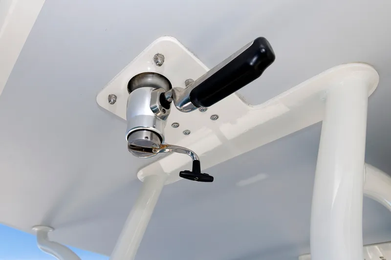 Slide: The Image of Close-up of a boat crank handle on a white roof, likely part of a 2018 Regulator 34SS. - 22
