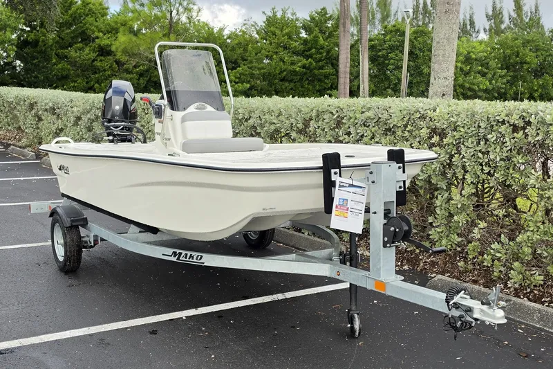 Slide: The Image of 2026 Mako Pro Skiff 13 CC boat on trailer in parking lot. - 3