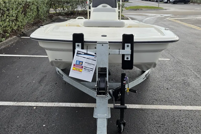 Slide: The Image of 2026 Mako Pro Skiff 13 CC on trailer in parking lot. - 5