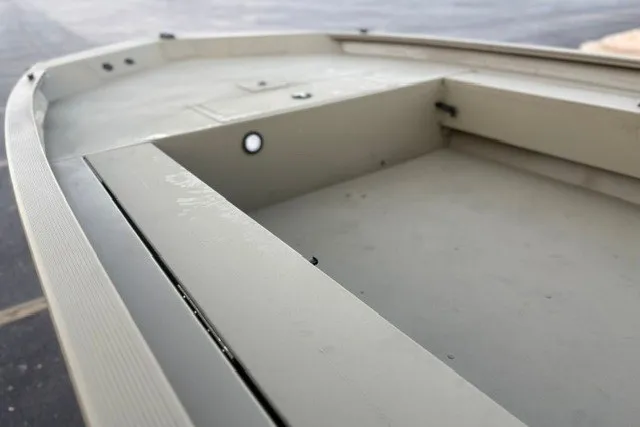 Slide: The Image of 2027 Tracker Grizzly 1654 T Sportsman boat interior, showcasing spacious deck design. - 19