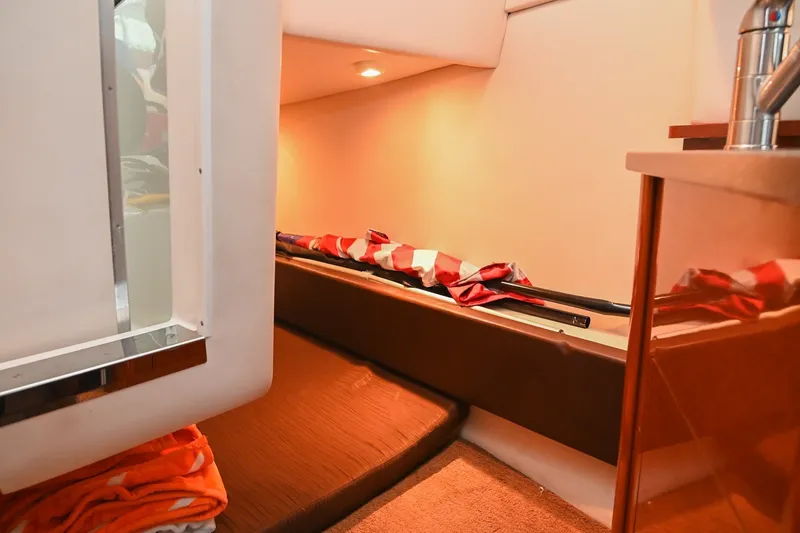 Slide: The Image of Interior cabin of 2014 Sea Ray Sundancer 260, featuring cozy seating and ambient lighting. - 56