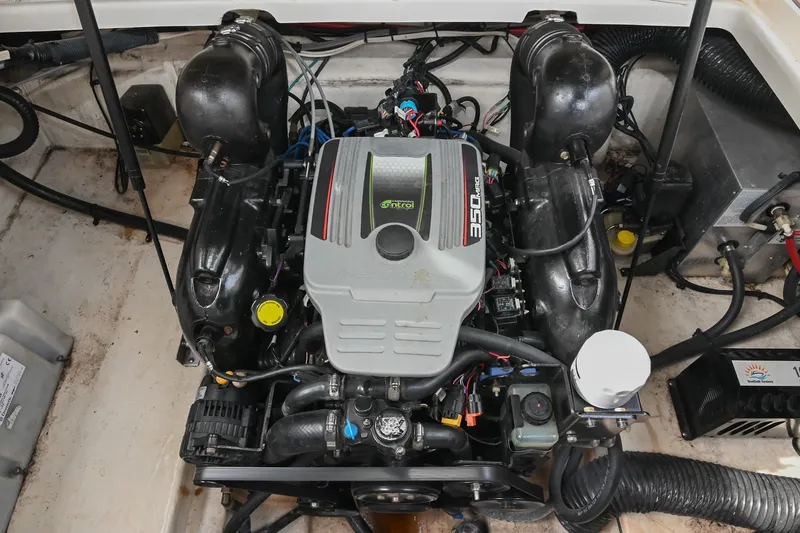 Slide: The Image of Engine compartment of a 2014 Sea Ray Sundancer 260 boat, featuring a 350 MAG engine. - 60