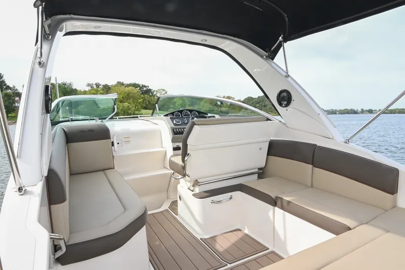Slide: The Image of 2014 Sea Ray Sundancer 260 interior with seating, helm, and water view. - 21