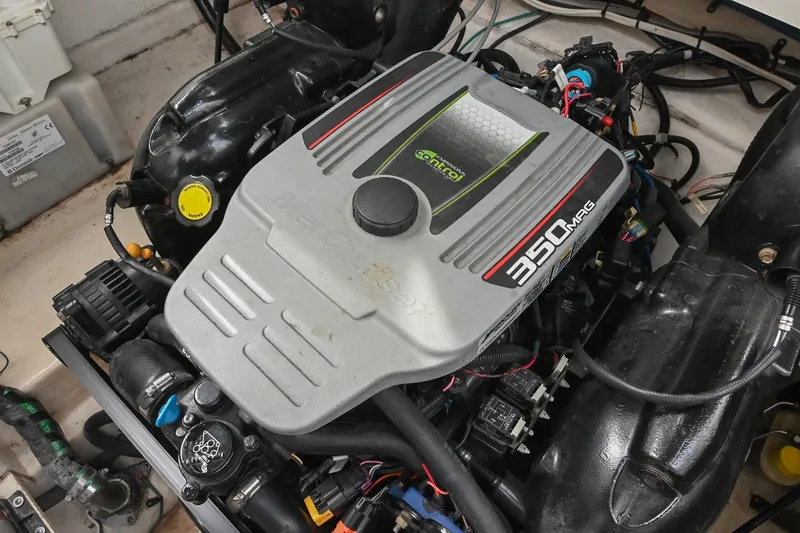 Slide: The Image of Engine of a 2014 Sea Ray Sundancer 260 boat, featuring a 350 MAG motor. - 59