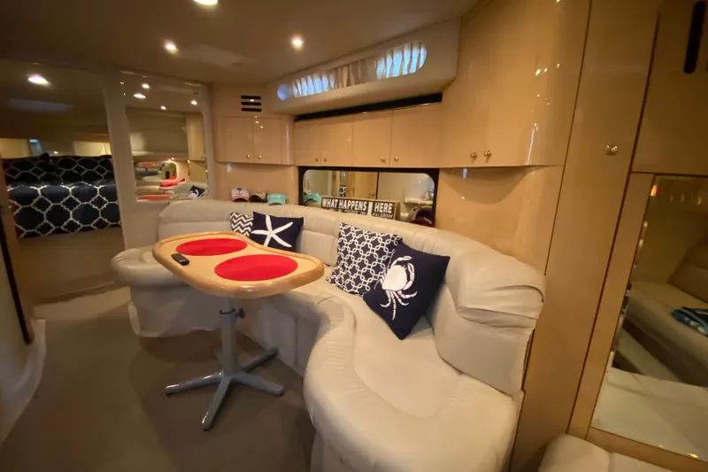 Slide: The Image of Luxurious interior of 1999 Sea Ray 380 Sundancer yacht with cozy seating and nautical decor. - 31